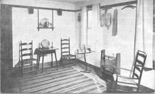 SA1687 - Photo is of a view of a room with chairs, rug, table, etc. Identified on the back., Winterthur Shaker Photograph and Post Card Collection 1851 to 1921c